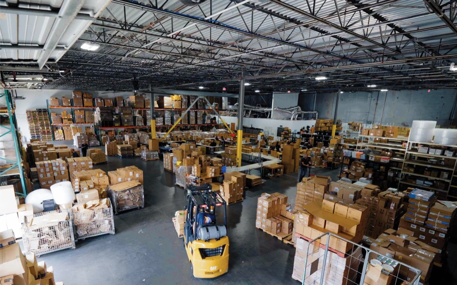 DC Company LLC distribution center in Orlando, Florida with palletized inventory and forklift operations